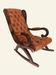Rocking chair with footrest, wood and tufted leather
