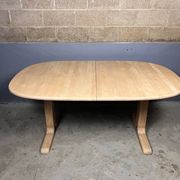 Oval extendable dining table in beech with Danish design.