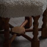 Pair of mid-century Danish oak stools with shearling lambswool upholstery, 1950s.