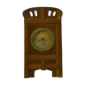 Fireplace clock of oak and the dial is of brass, from around the 1920s