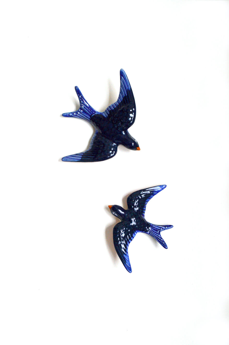 Couple of ceramic wall swallows