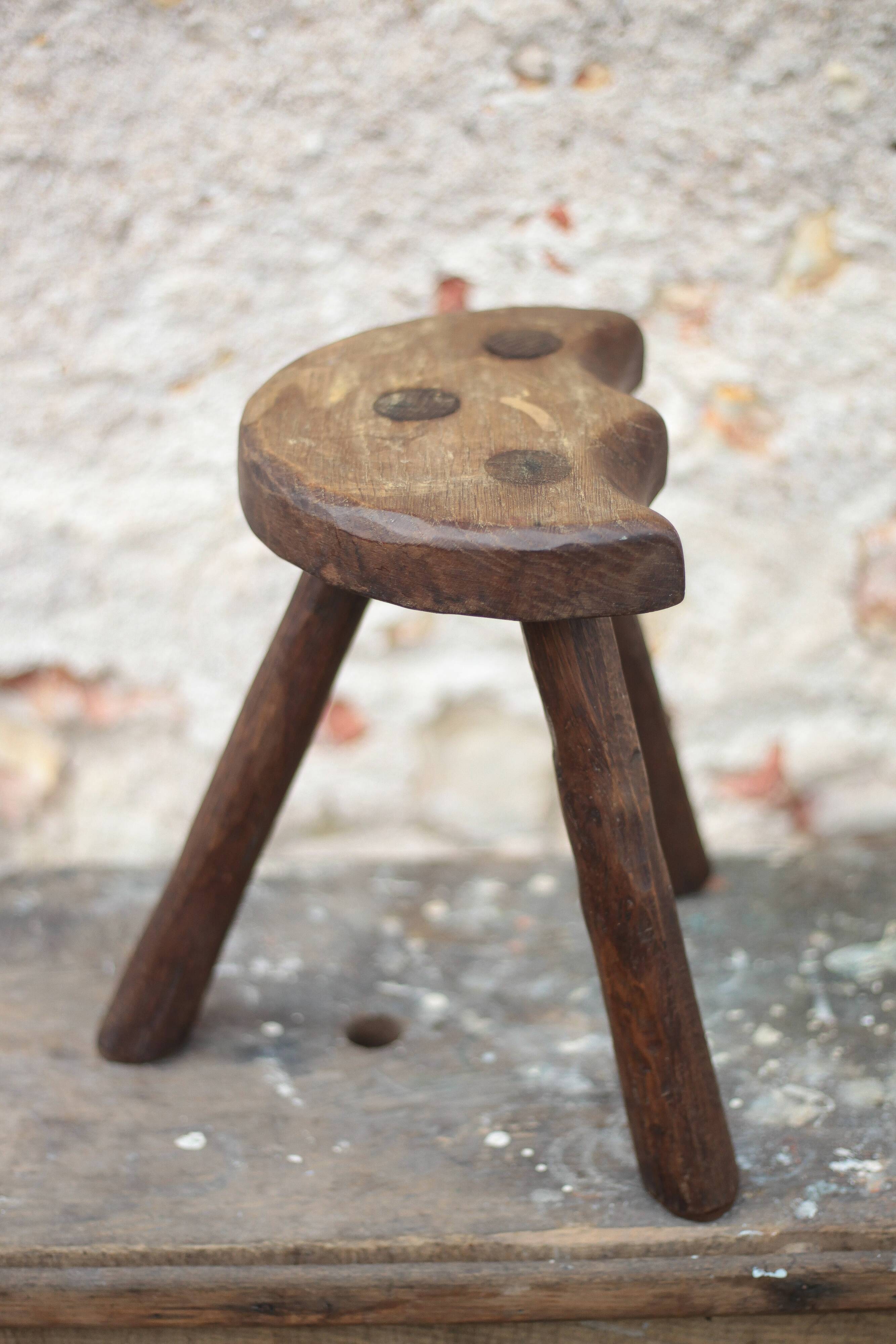 Vintage wooden tripod stool, mountain work, wabi-sabi, shepherd.