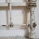 Cast-iron headboard and patinated white wood