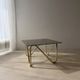 Coffee table with smoked glass and curved metal base