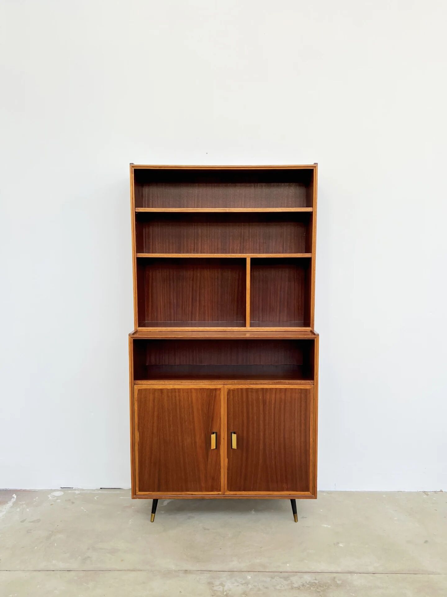 Mahogany library — closed storage and open cubbies, custom-made, 1960s.