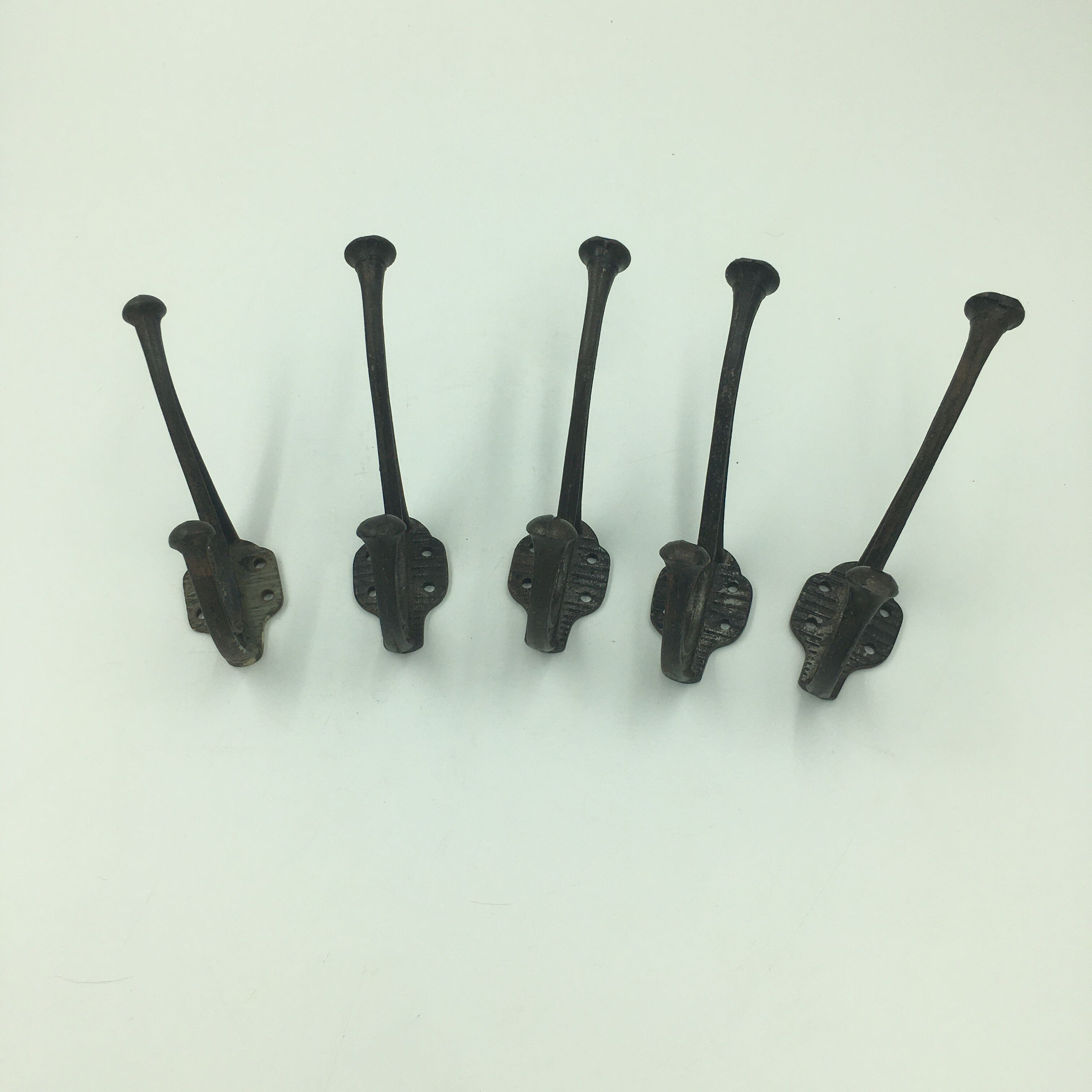 Set of 5 cast iron hooks early 20th