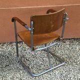 Modernist armchair in plywood, screwed steel tubes