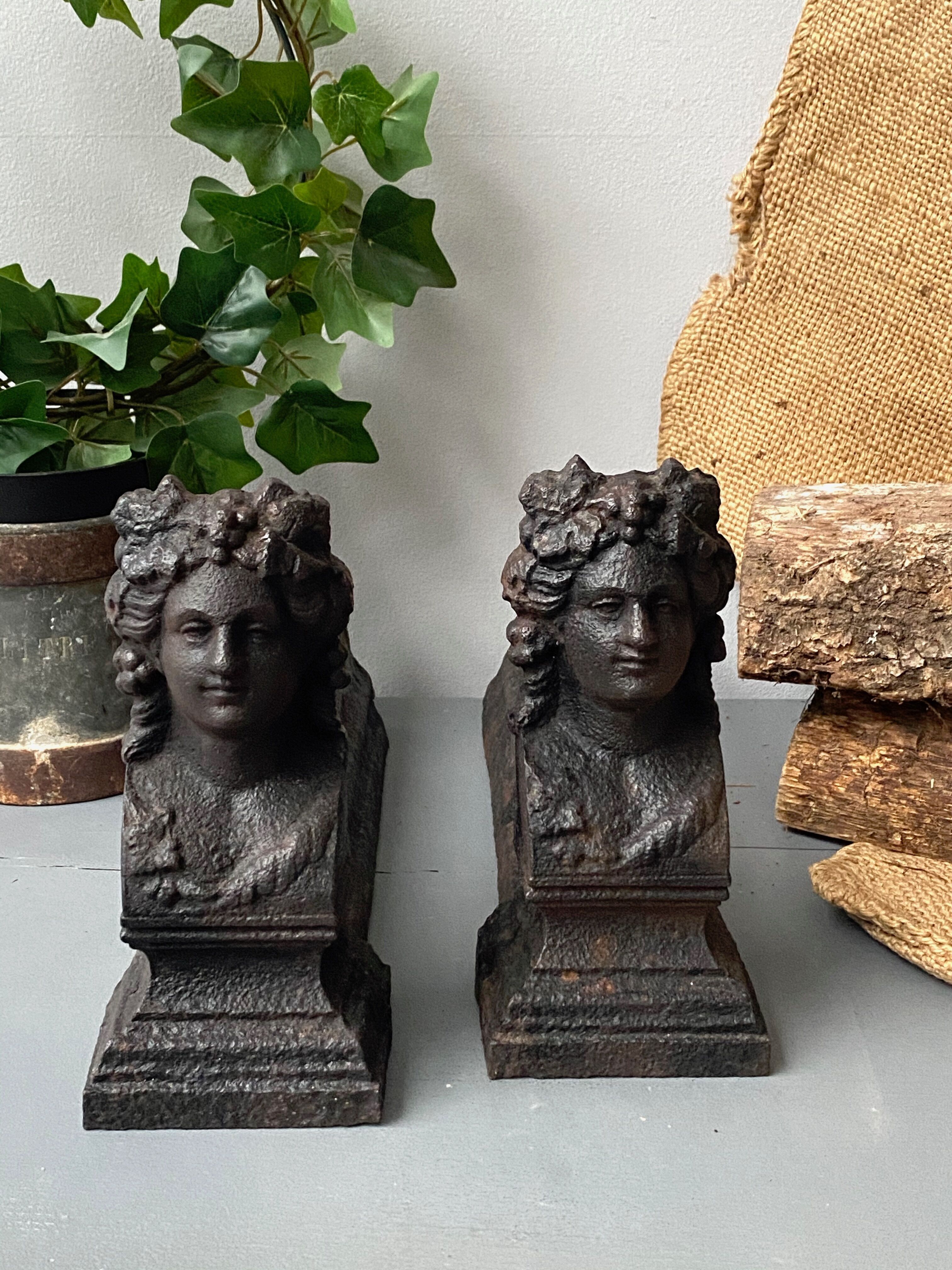 Pair of cast iron pegs