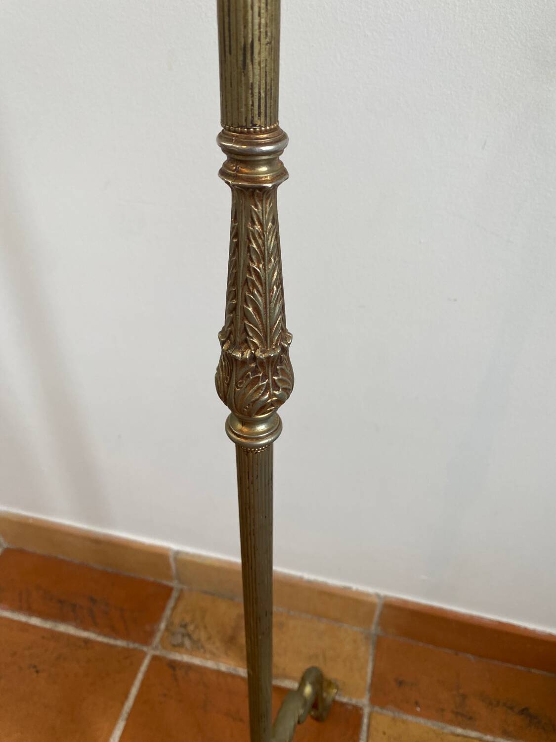 Gold-colored iron floor lamp