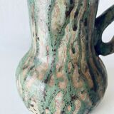 Old pitcher in glazed terracotta