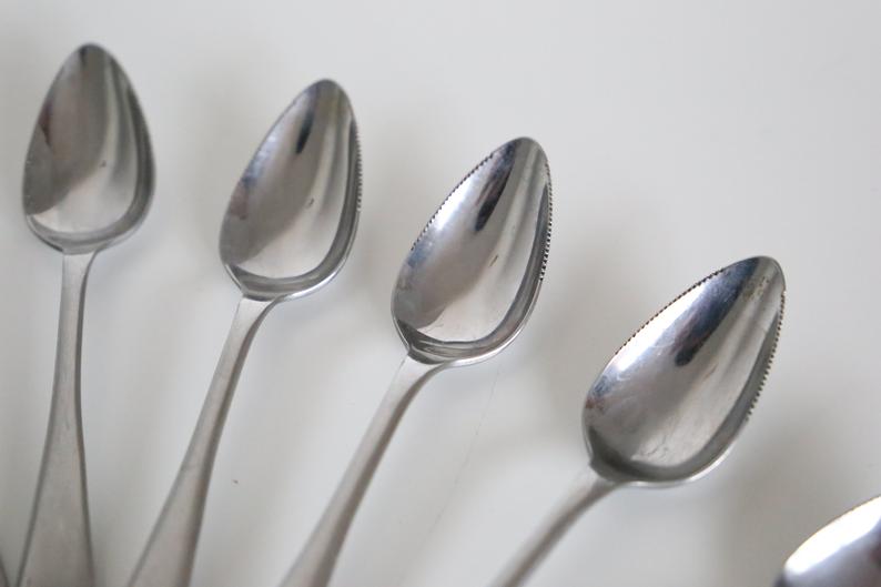 Serving small notched spoons for grapefruit