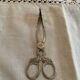 Sugar tongs or sweets in silver metal