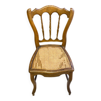 Antique wooden chair, cane seat