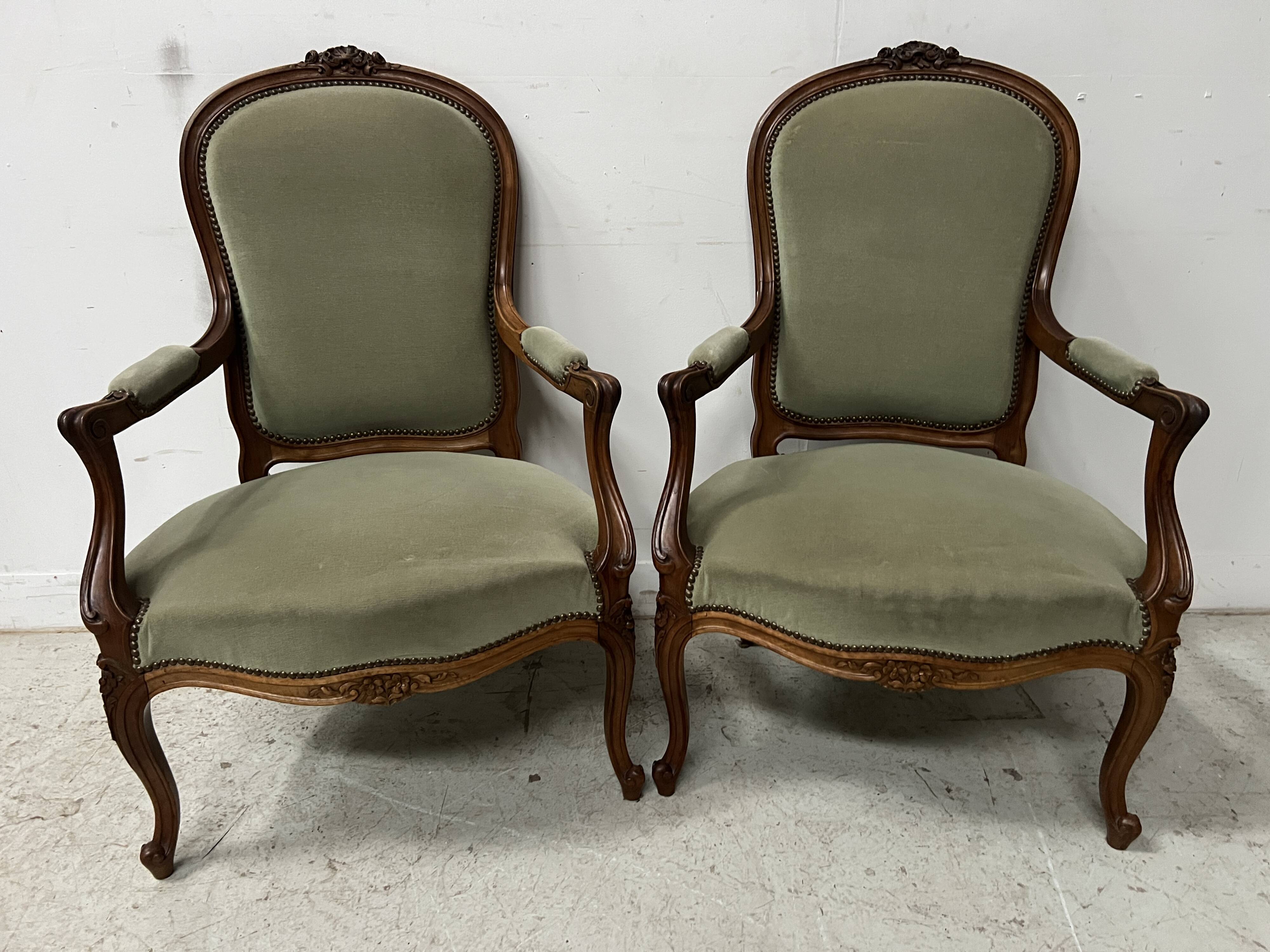 Pair of Louis XV style armchairs in solid walnut, 20th century.