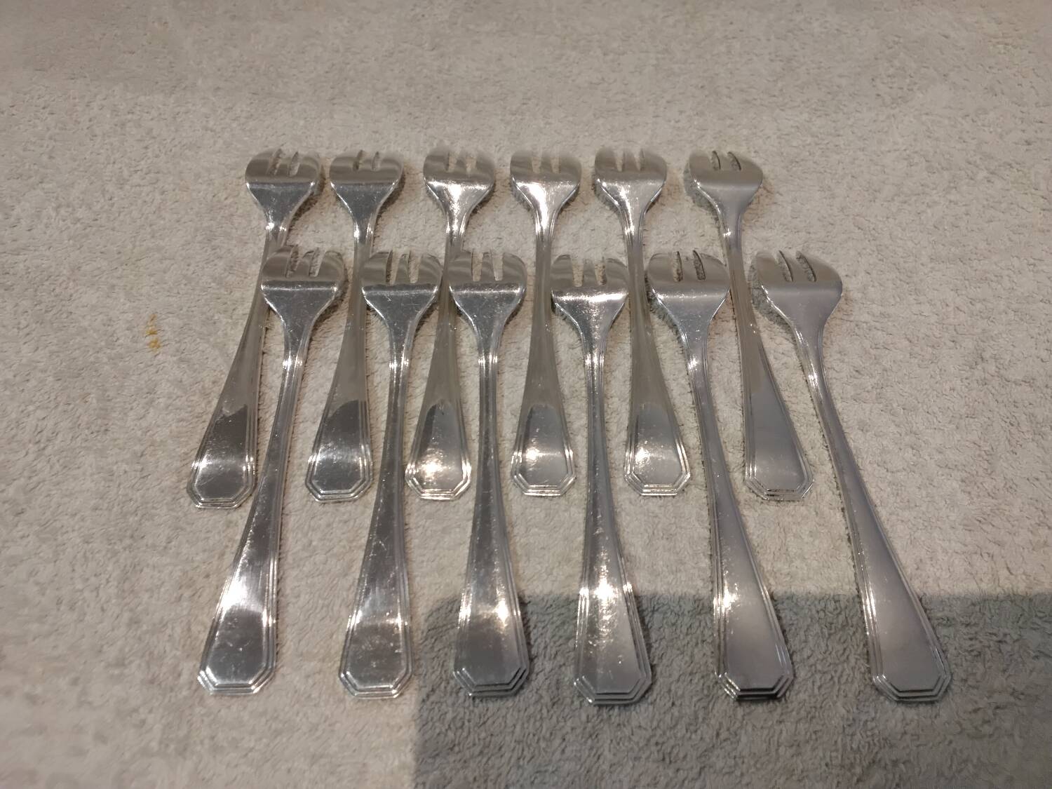 12 silver-plated oyster forks by Christofle America