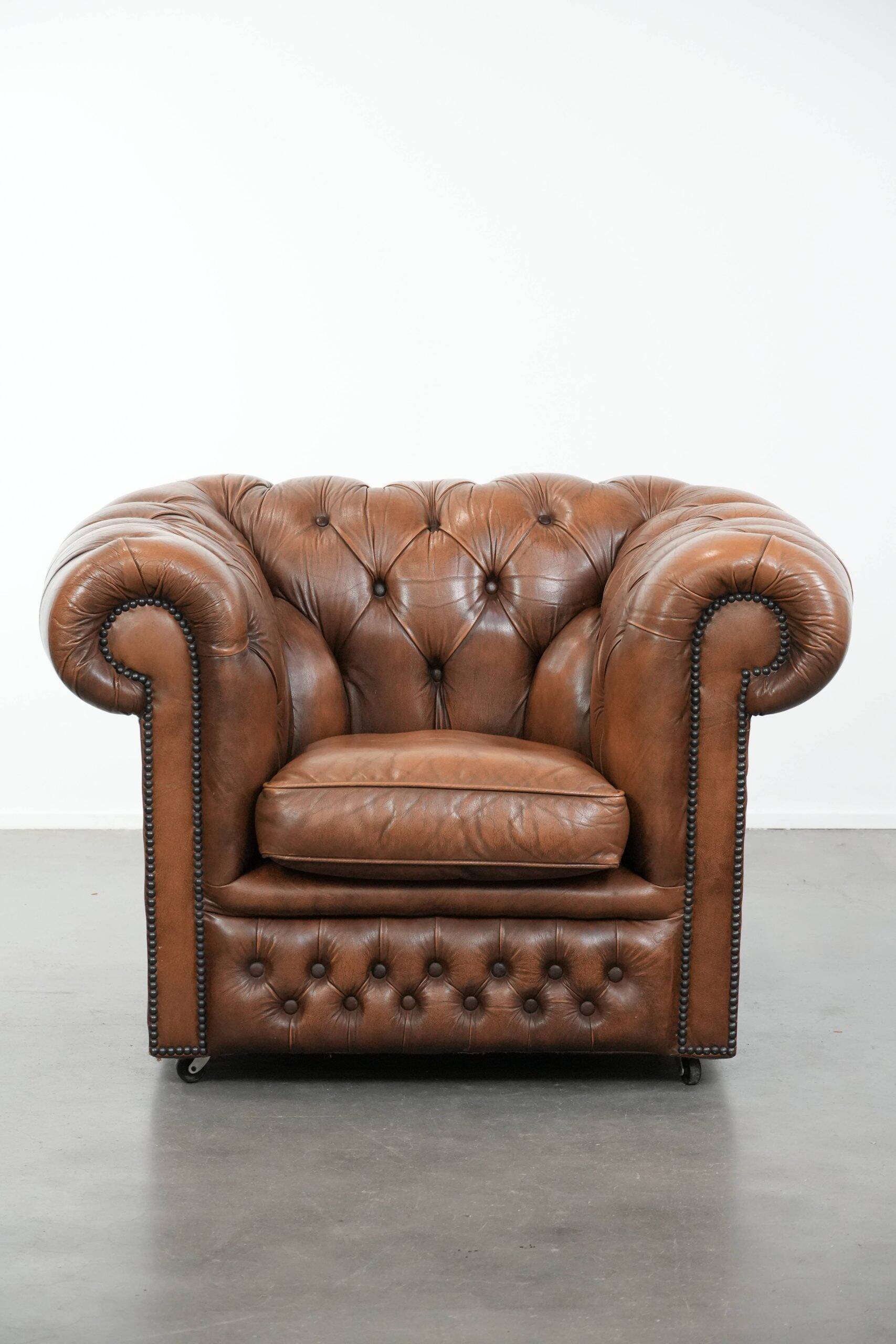 Brown cowhide leather chesterfield armchair  in English style on wheels