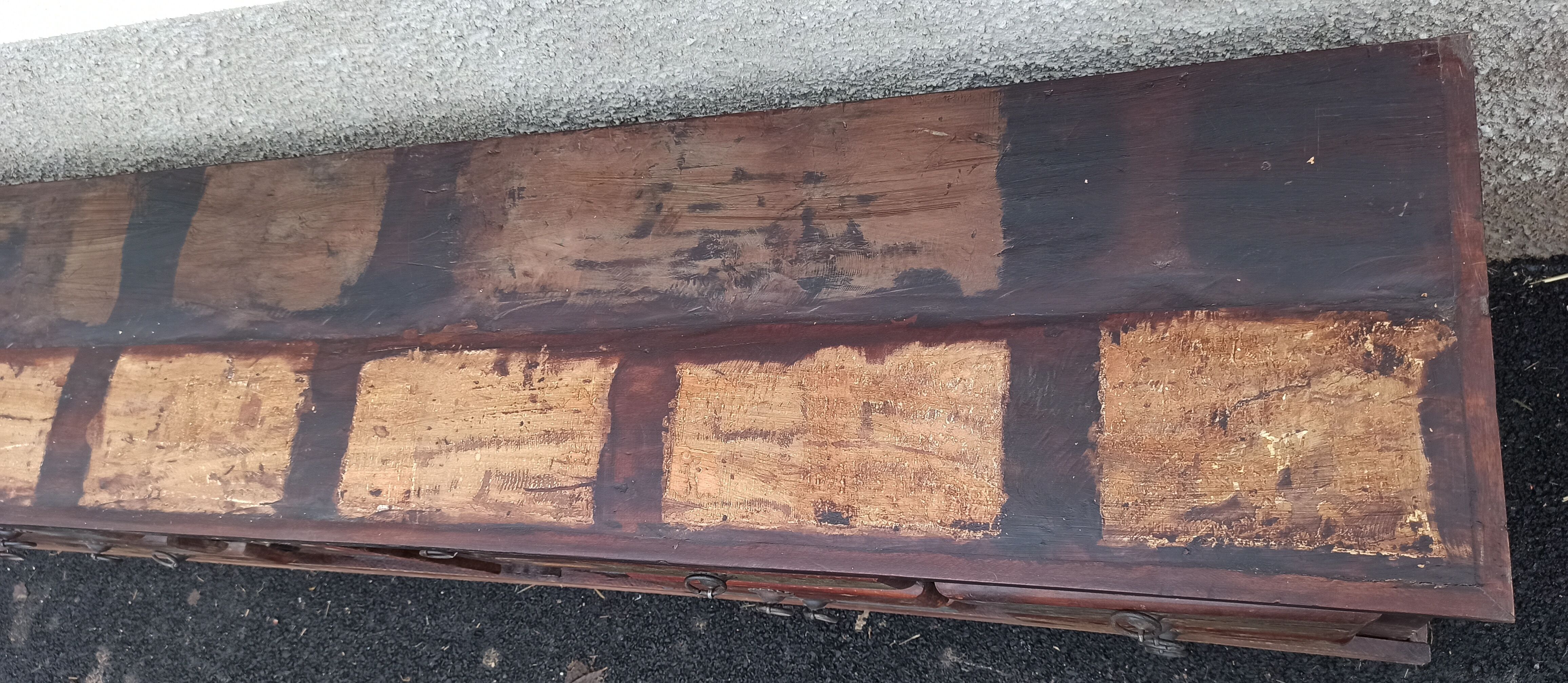 Furniture low in colorful wood. 12 drawers and 1 door