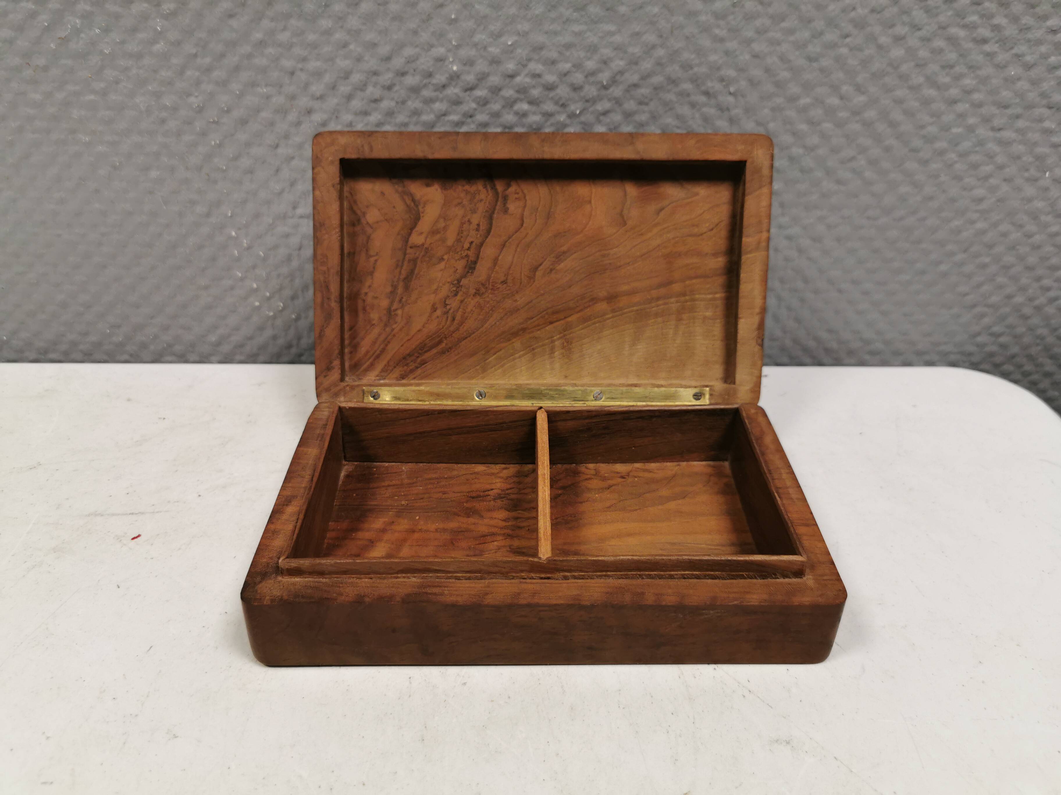 Wooden trinket box for storing jewellery, cigarettes or similar items.