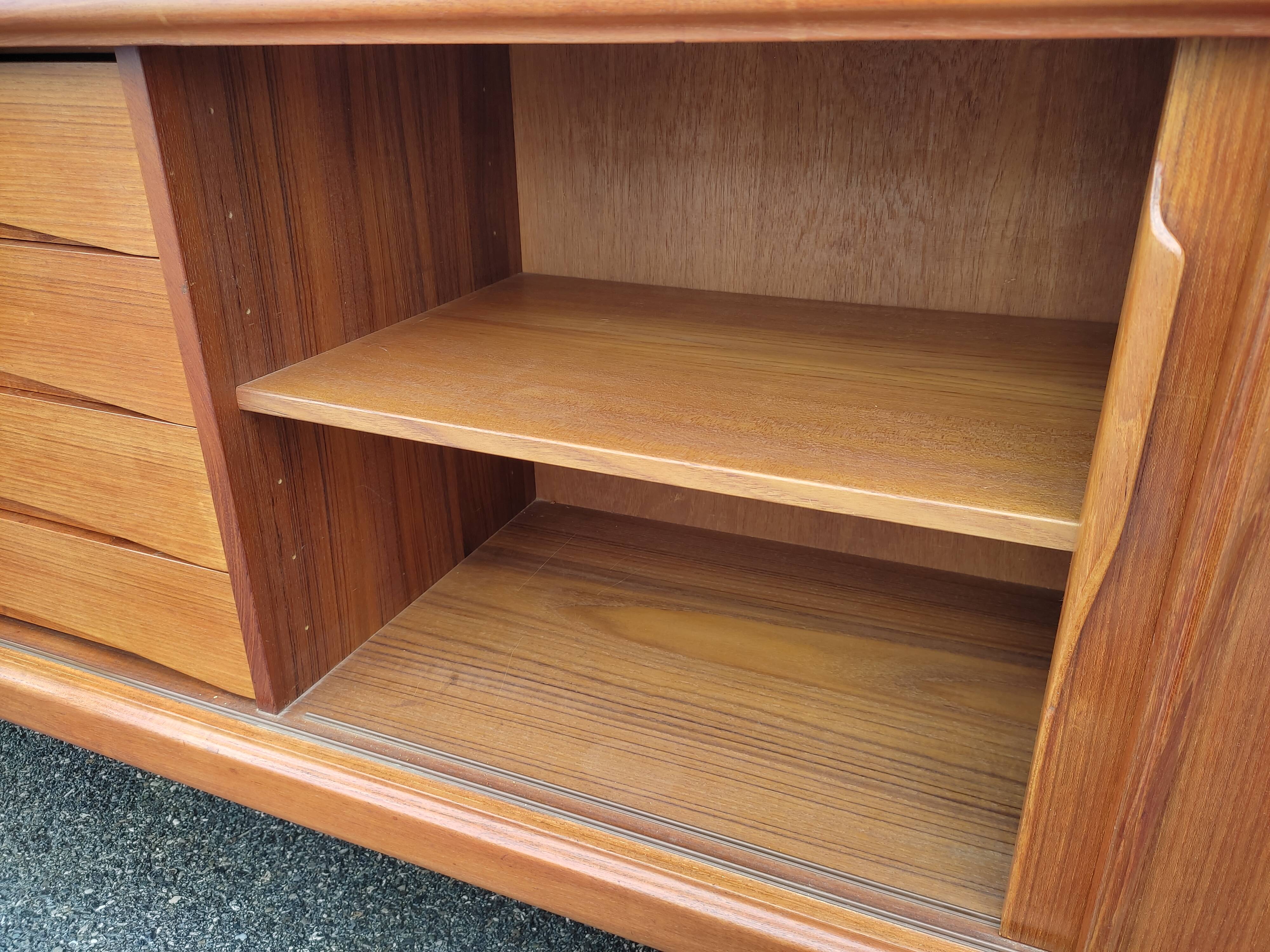 Scandinavian teak row by Axel Christensen for ACO Mobler