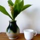 small green and cream glazed ceramic vase