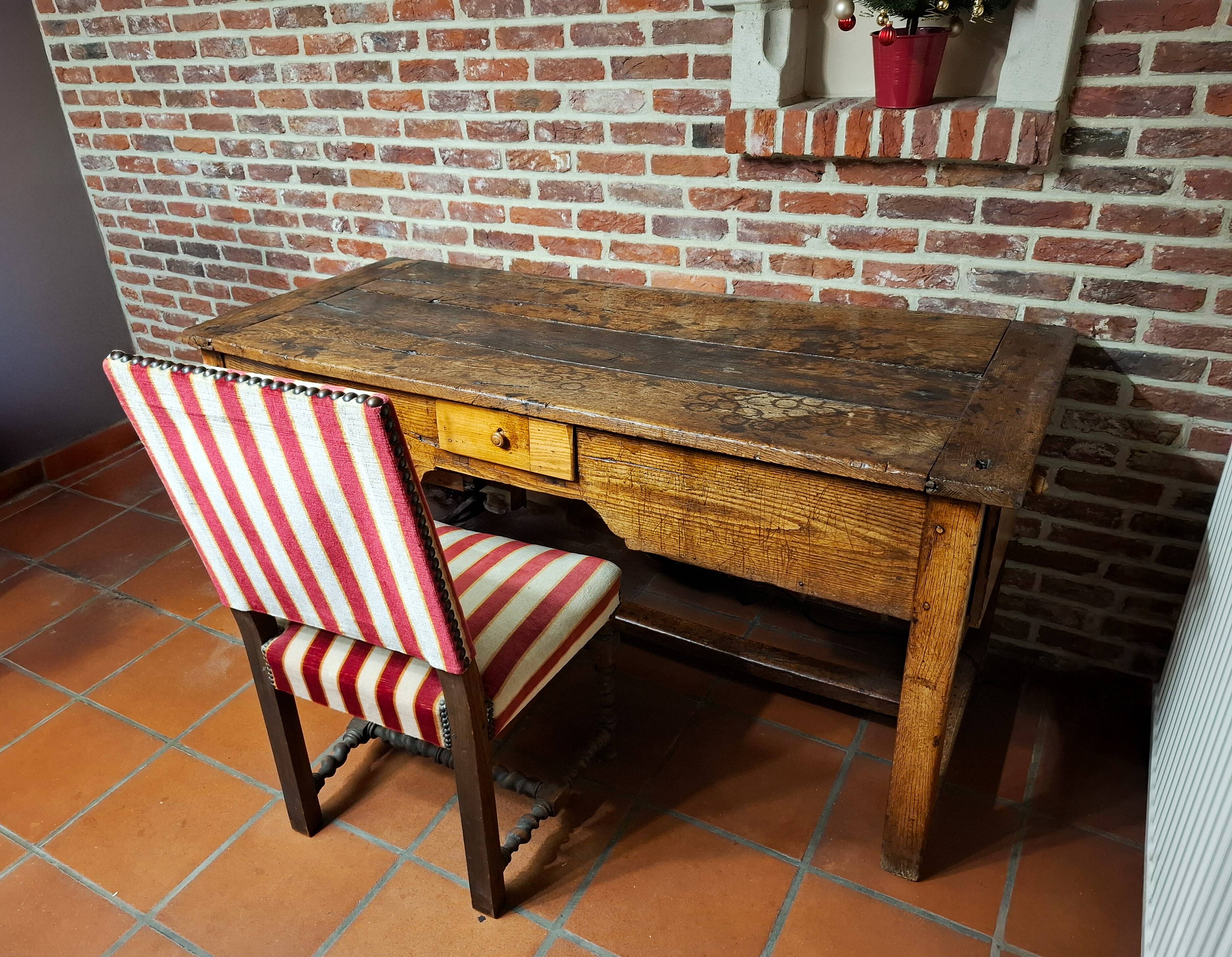 Antique desk accompanied by its chair – first half of the 18th century.