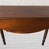 Oval walnut table with flaps