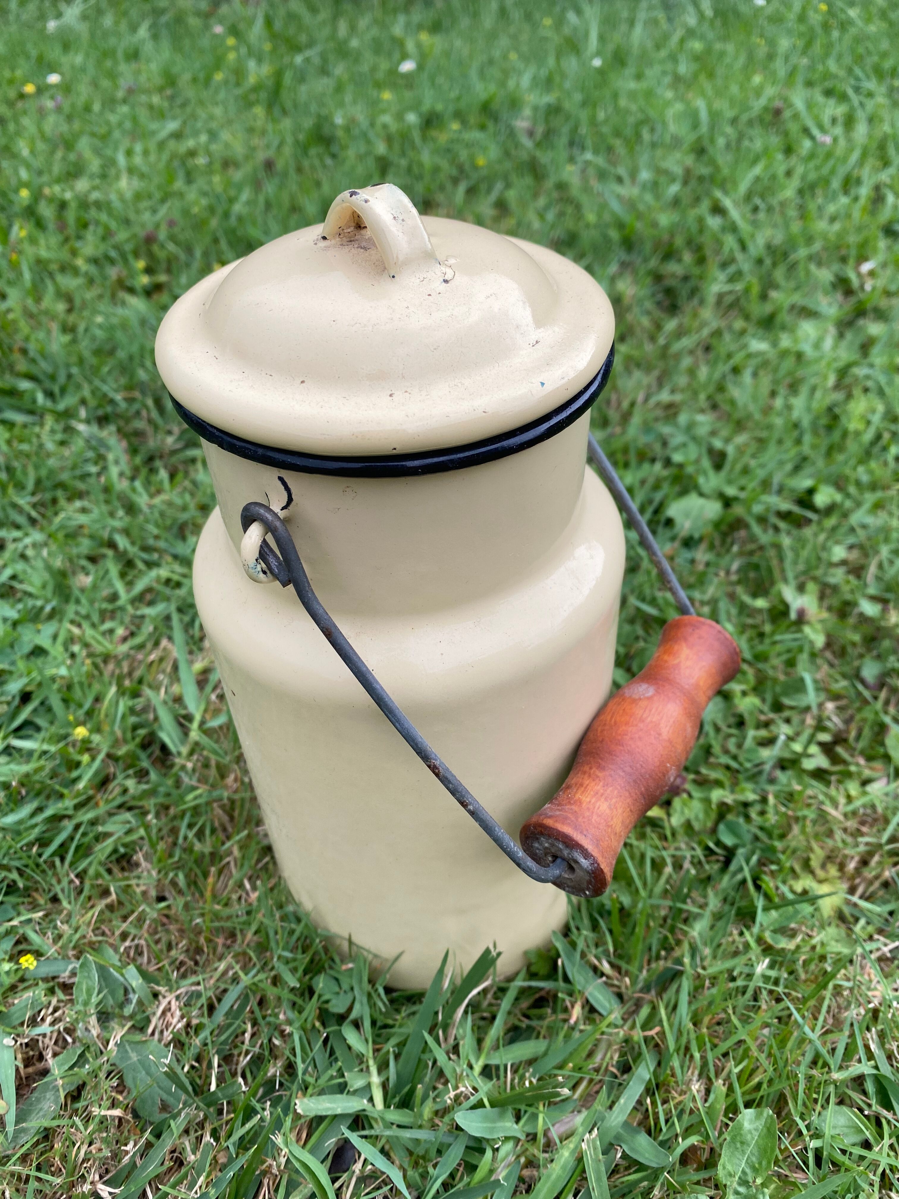 Old milk pot in enamelled sheet metal