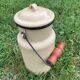 Old milk pot in enamelled sheet metal