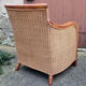 Fauteuil esprit colonial, bois et rotin, accoudoirs