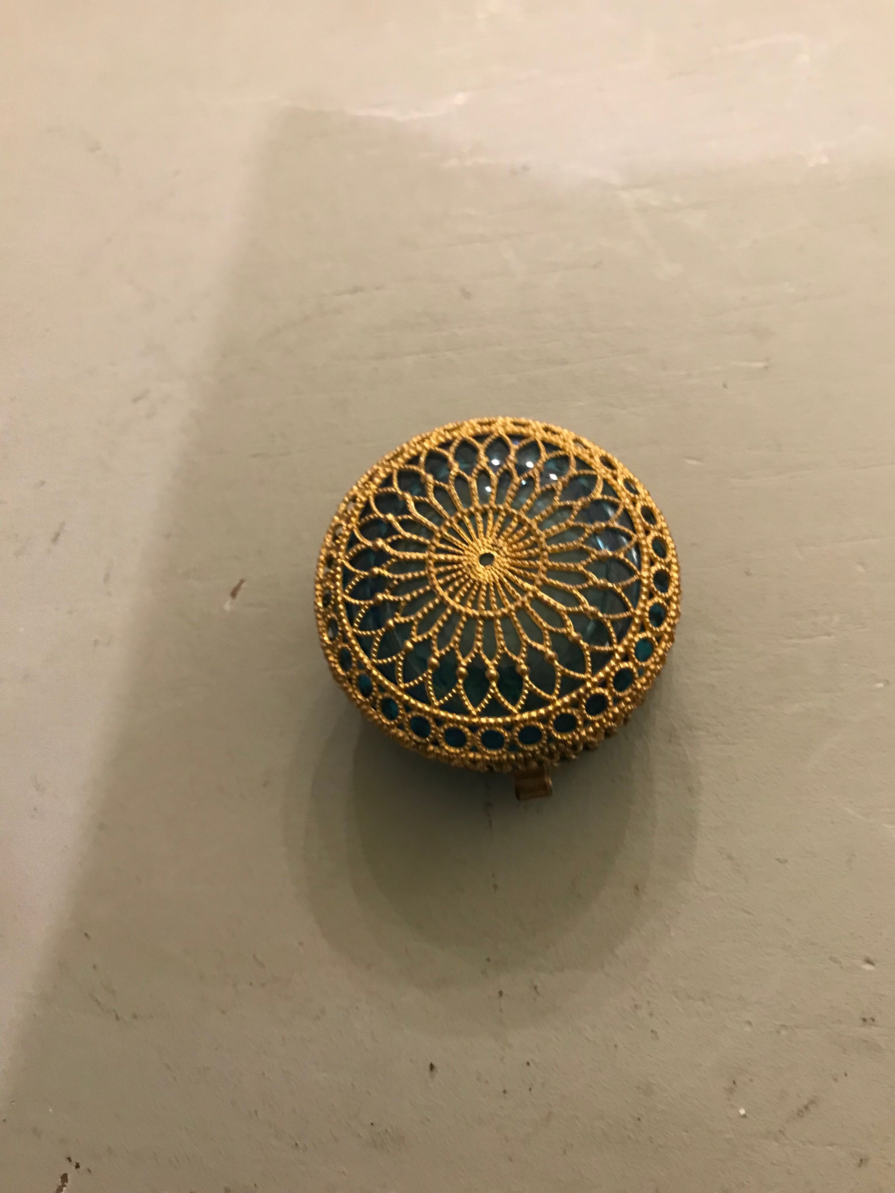 Old pill box made of golden thread