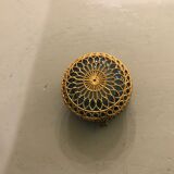 Old pill box made of golden thread