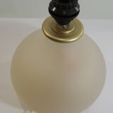 Vintage frosted glass lamp, round globe, elegant design, soft light.