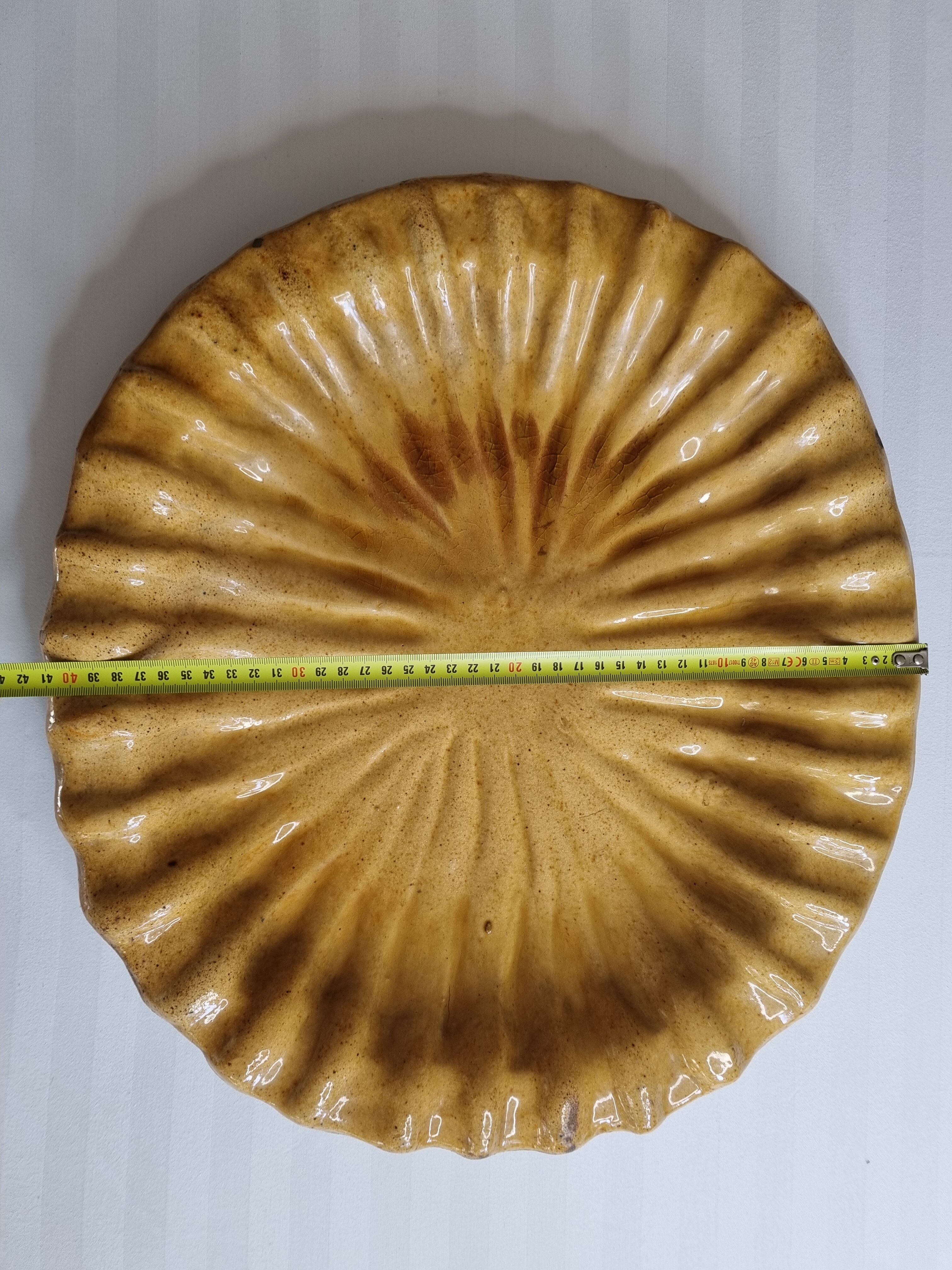 Large dish in enamelled terracotta, ochre, 47 cm