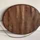 Antique oval mirror in gilded wood, bevelled mercury glass, 19th century.