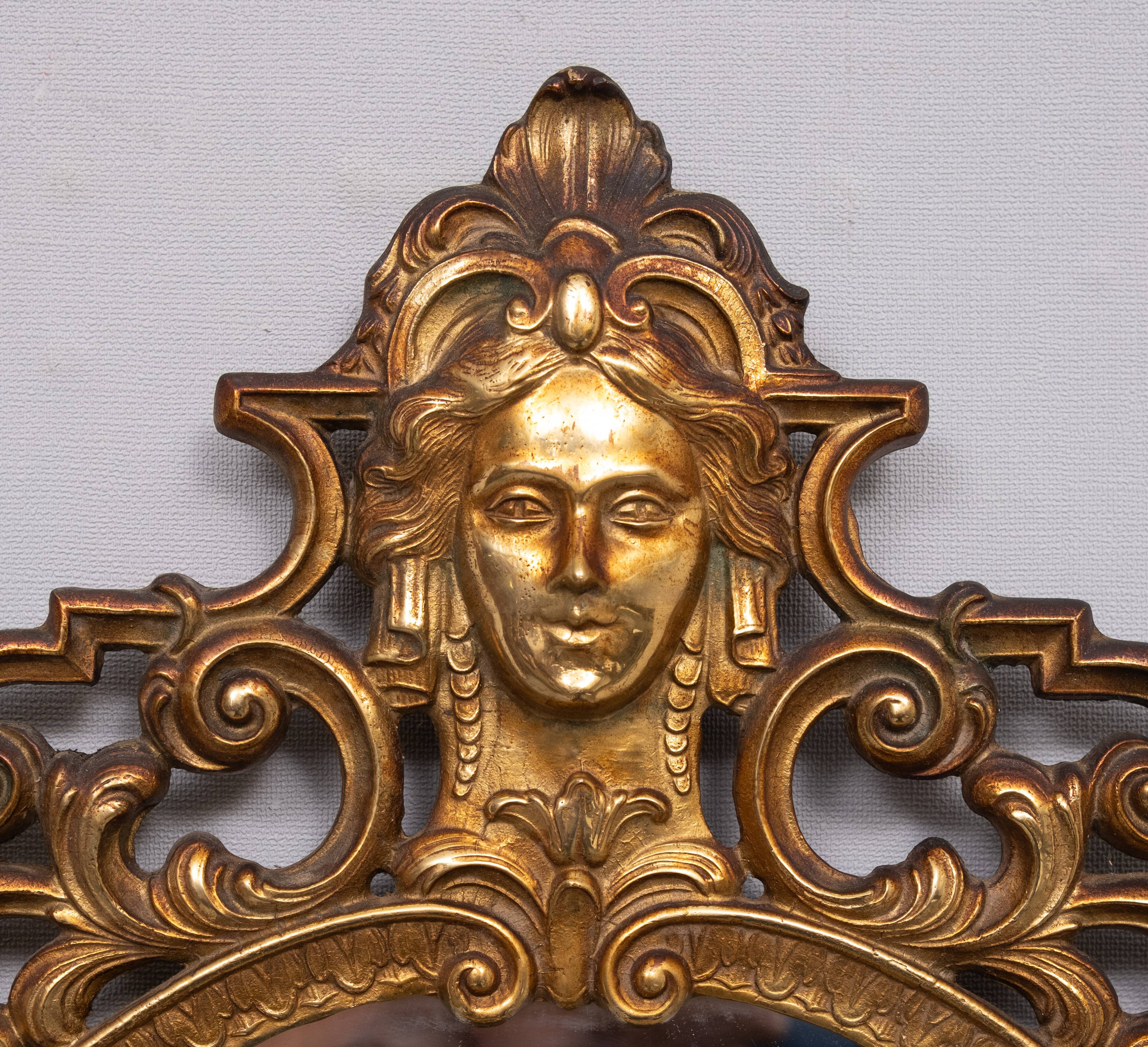 Classic gilded brass console with oval mirror from the 1950s, Italy.