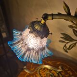 Bronze and brass lamp, transparent and blue glass shade.