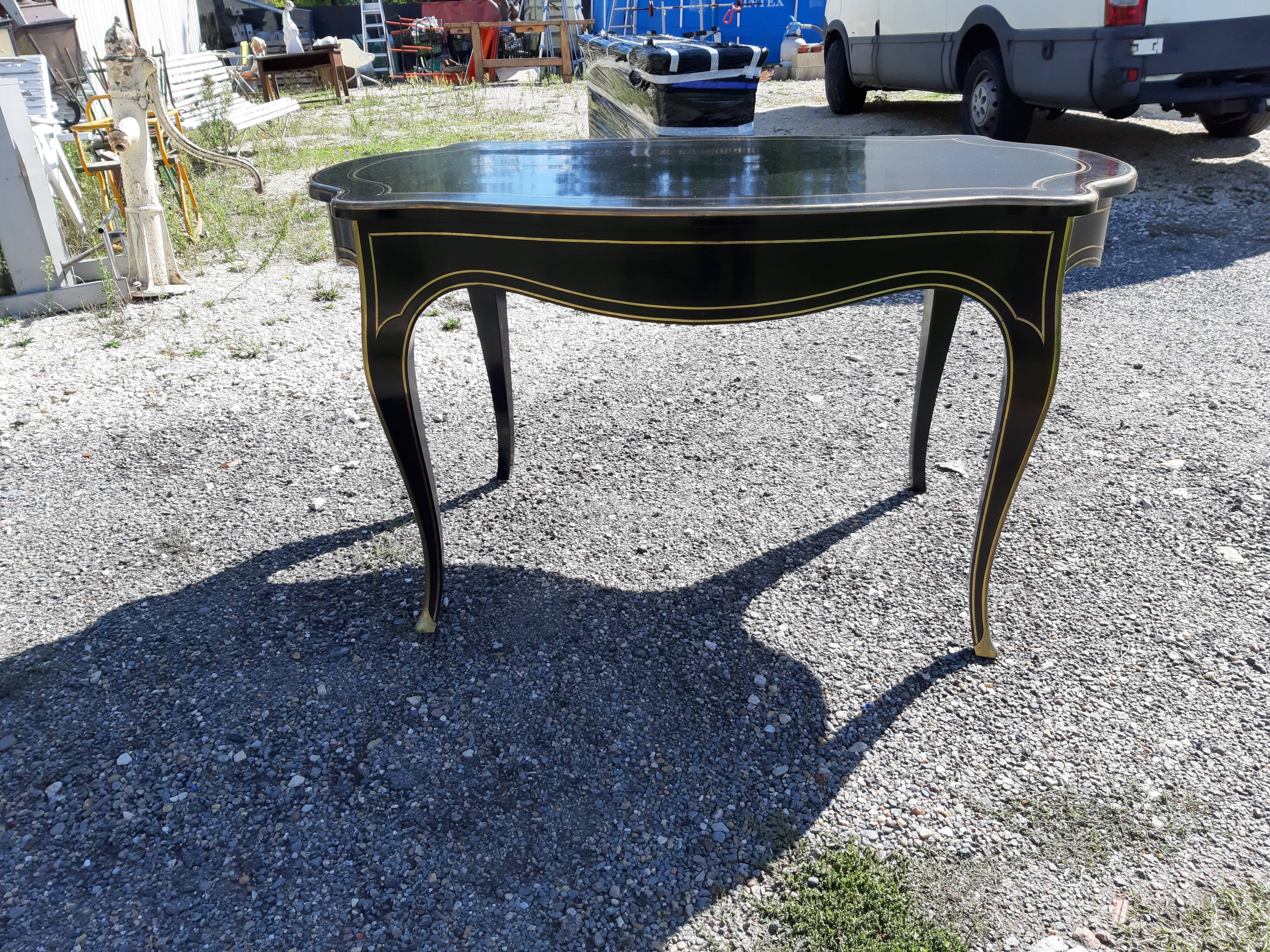 Napoleon III black lacquered wood and brass table