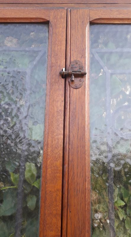 Oak entrance door and its frame and transom, wrought iron gates