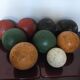Very old game of wooden petanque balls with piglet