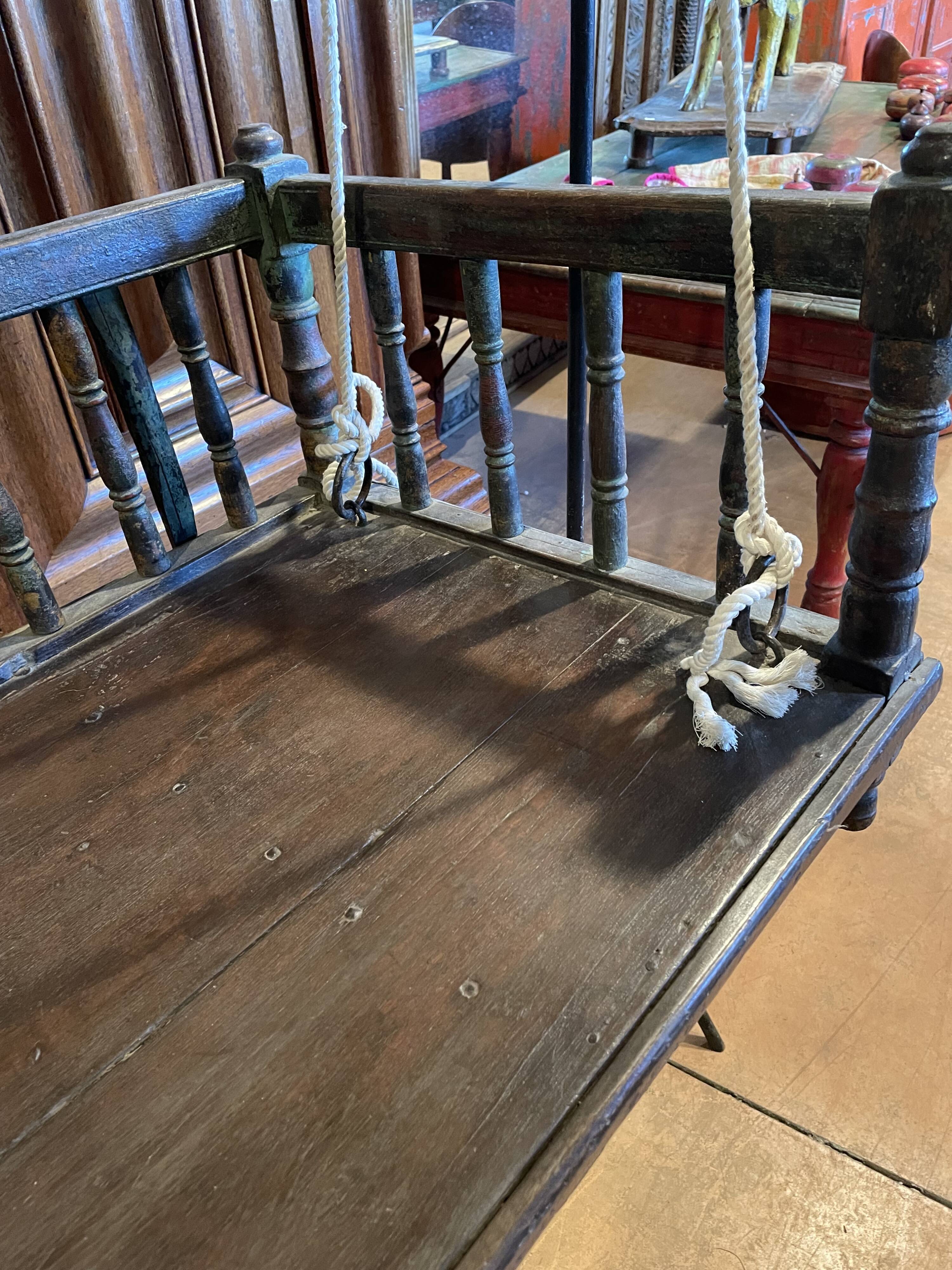 Black lacquered teak rocking chair