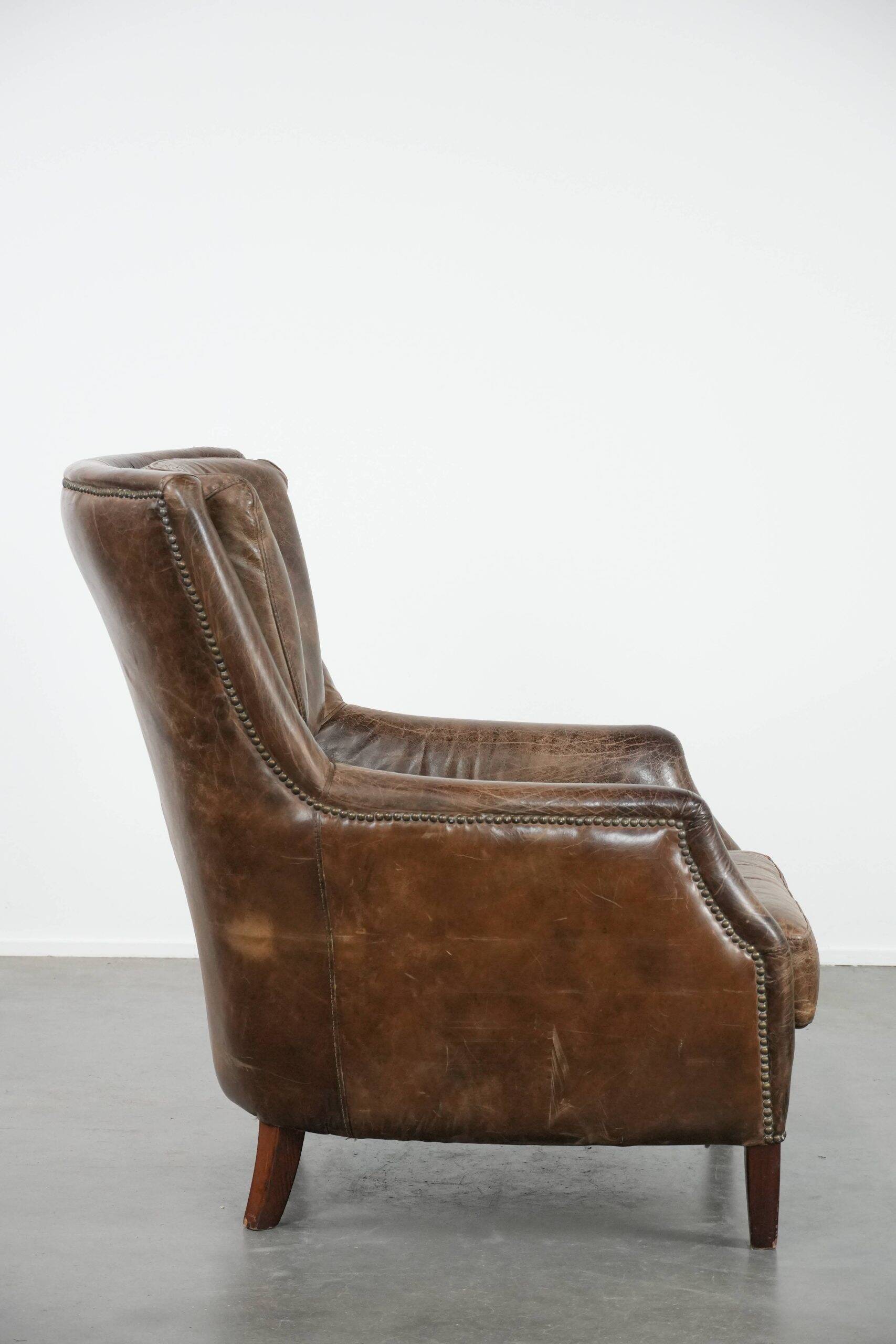 Very comfortable vintage cow leather armchair with beautiful colours