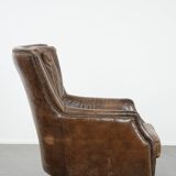 Very comfortable vintage cow leather armchair with beautiful colours