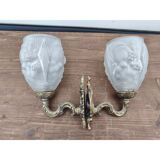 Pair of brass wall lights and glass paste.