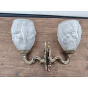Pair of brass wall lights and glass paste.
