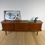 Vintage teak sideboard with rounded edges and sliding doors – mid-century Scandinavian design.