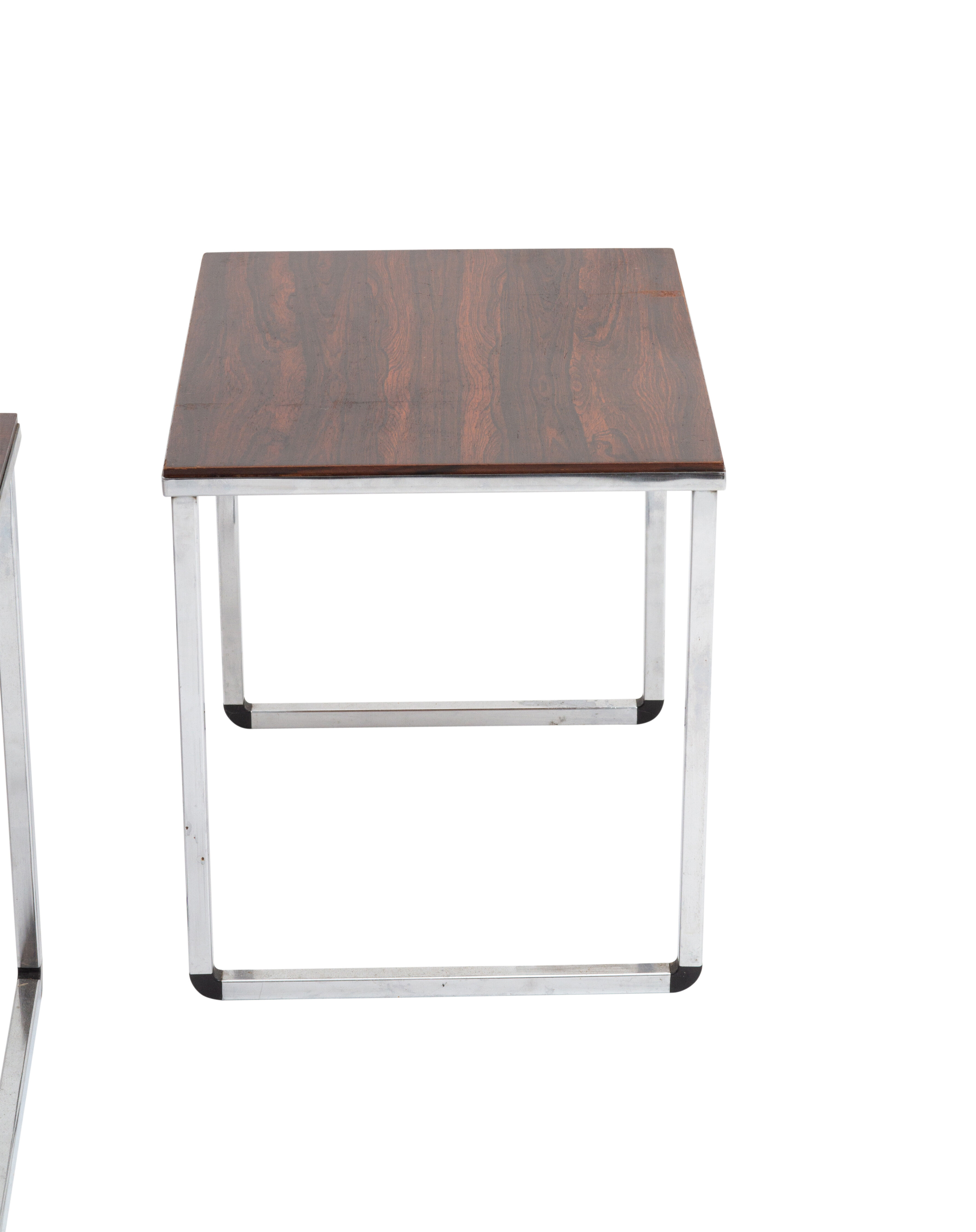 Vintage nesting table in rosewood and high polished metal base.