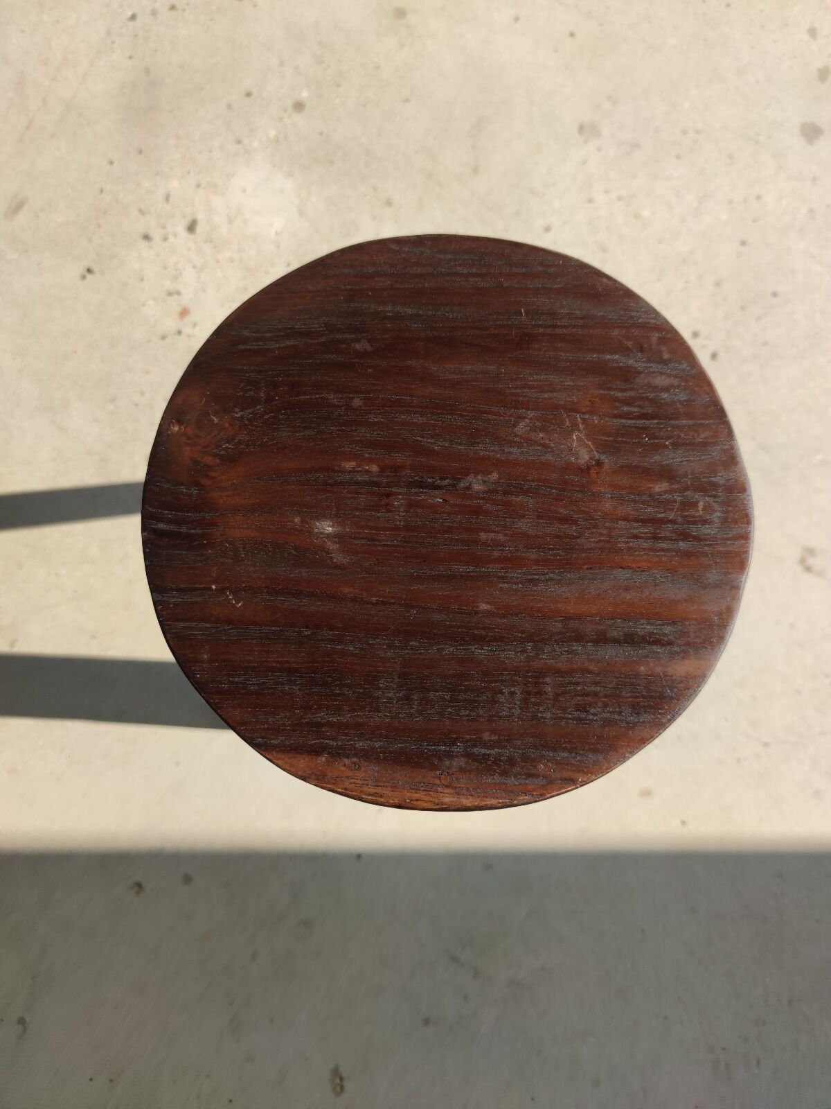 Small high tripod stool in brown solid wood