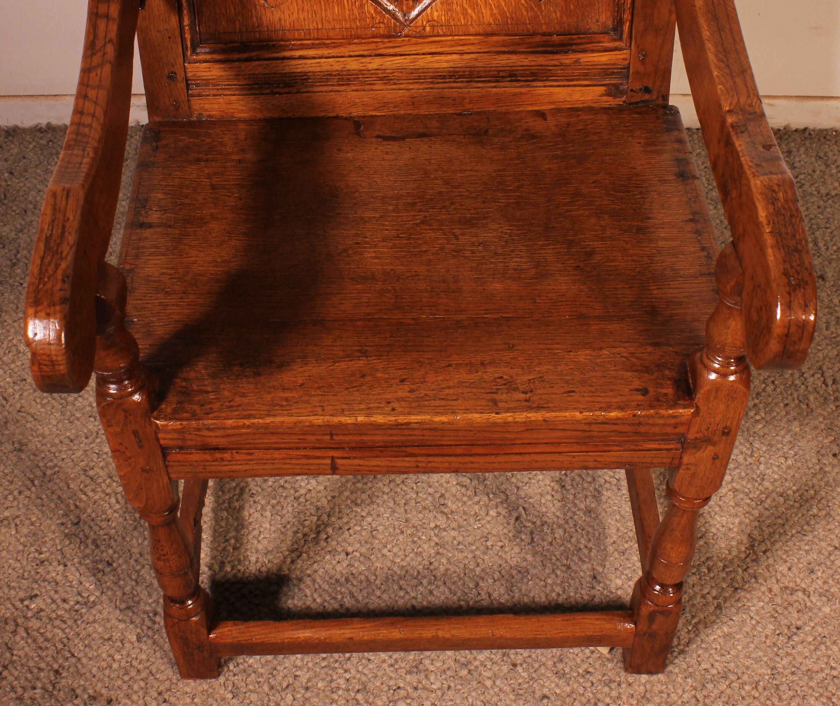 high-backed armchair from the 17th century in oak