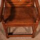 high-backed armchair from the 17th century in oak