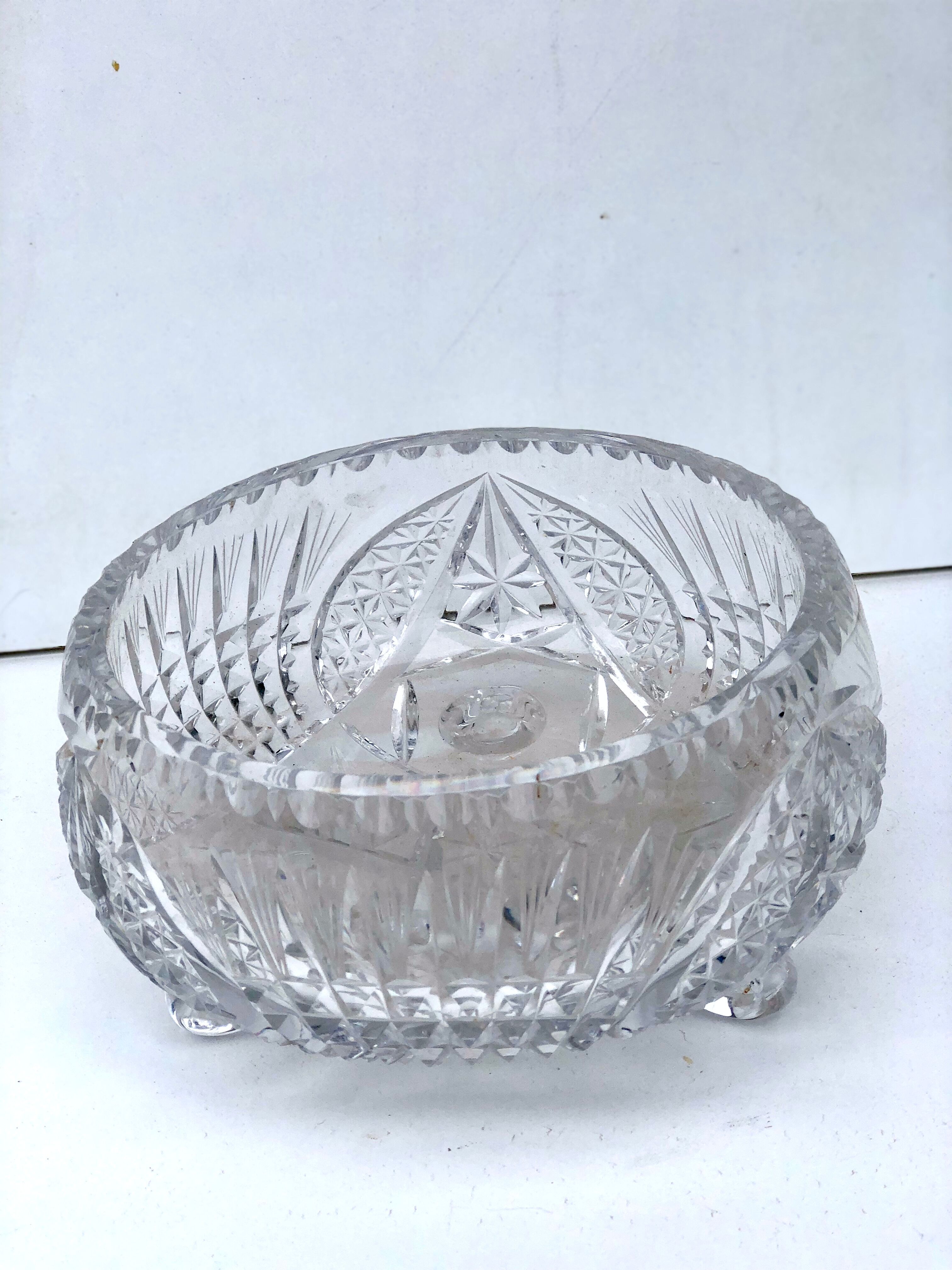 Chiseled glass basket cup on legs